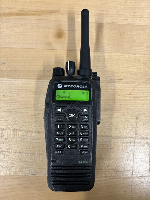 Front photo of a Motorola XPR6550. The radio features a small monochrome LCD screen and a keypad