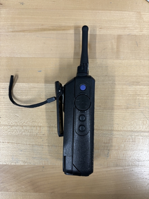 Side photo of a Motorola XPR6550. Notably, the radio is bulky, about 4 centimeters thick including the battery